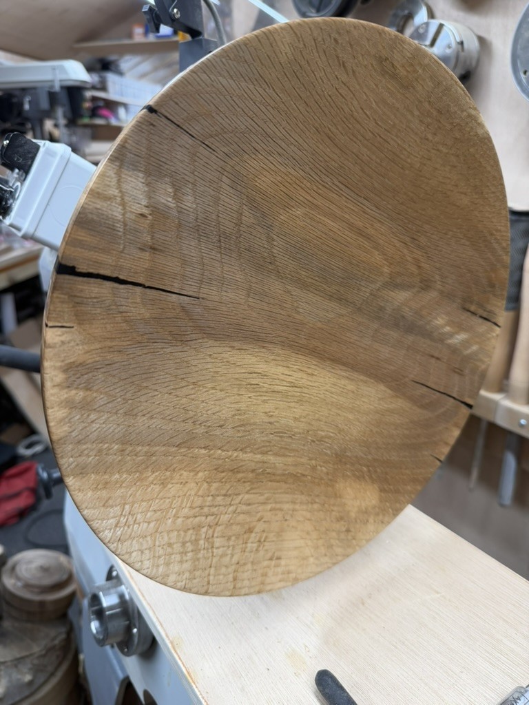 The finished face on the lathe, ray fleck catching the light